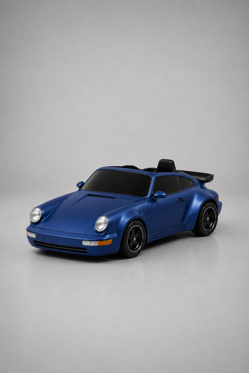 A blue drift car resembling a classic sports car, shown from a three-quarter front angle on a light gray studio background.